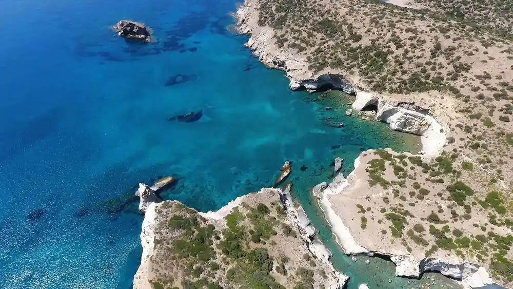Aerial view of a rocky coast cut by clear channels