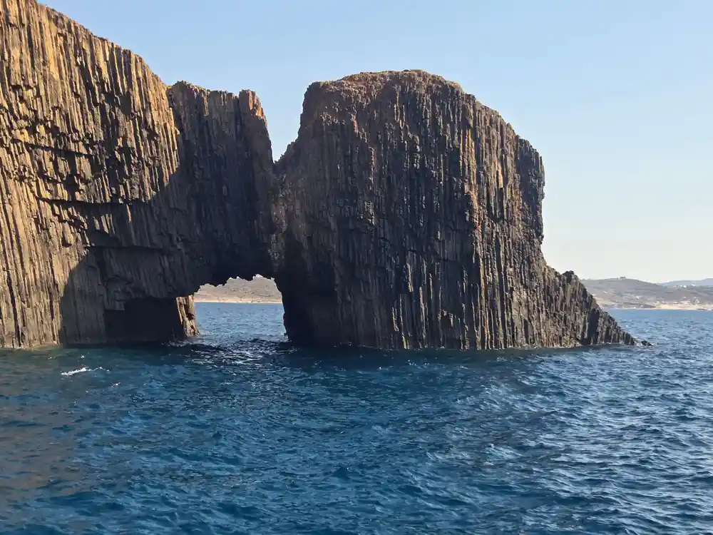 Basalt sea stack pierced by a natural arch