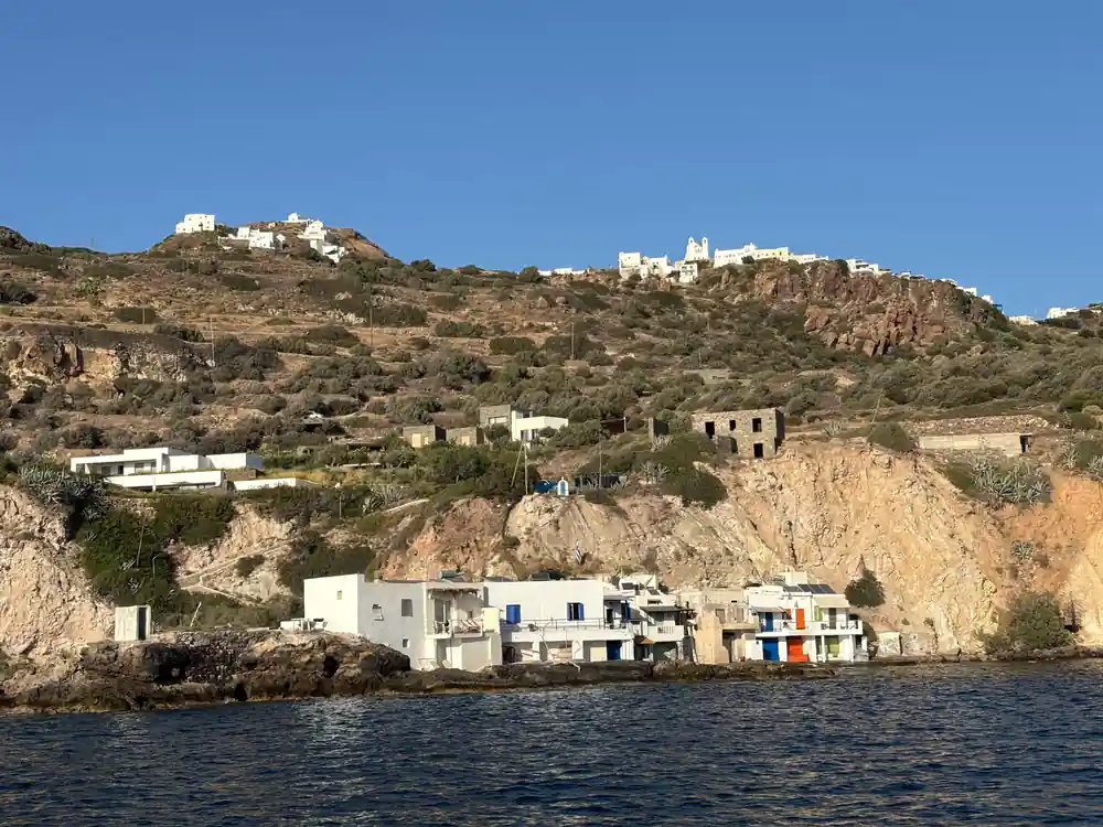 Hillside village above a shoreline of small white houses